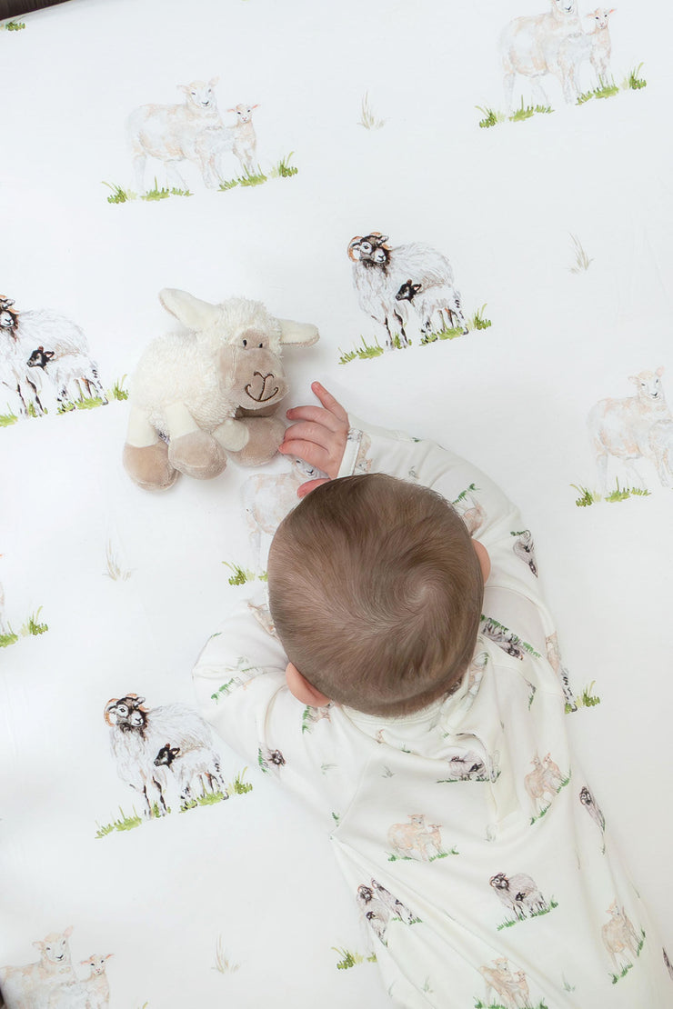 Sheep Lamb organic cotton cot bed sheet for baby and toddler displayed in cot by The Little Stamford Co