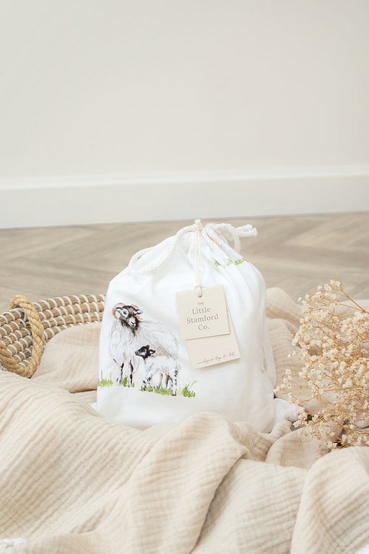 Sheep Lamb organic cotton cot bed sheet for baby and toddler displayed in cot by The Little Stamford Co